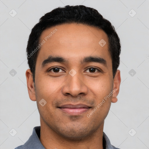 Joyful latino young-adult male with short  black hair and brown eyes