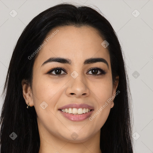 Joyful latino young-adult female with long  brown hair and brown eyes