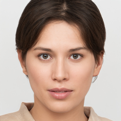 Neutral white young-adult female with short  brown hair and brown eyes