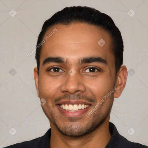 Joyful latino young-adult male with short  black hair and brown eyes