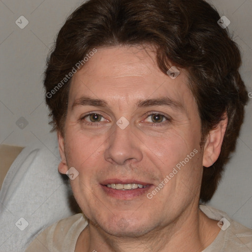 Joyful white adult male with medium  brown hair and brown eyes