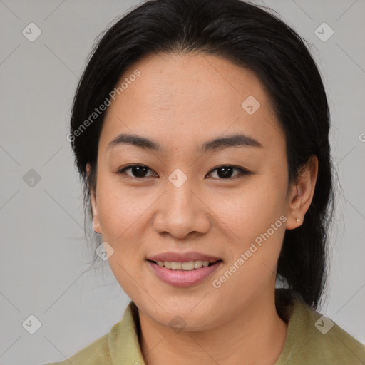 Joyful asian young-adult female with medium  black hair and brown eyes