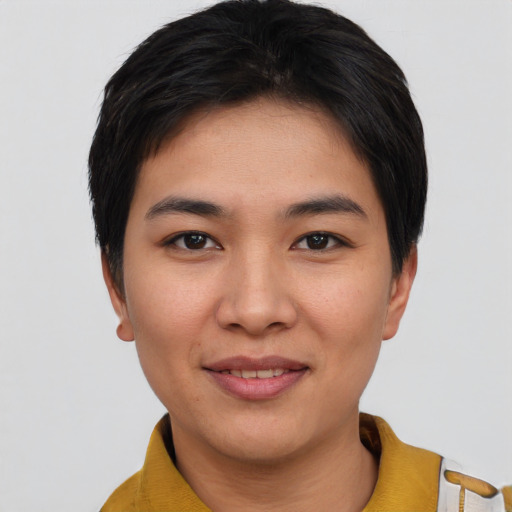 Joyful asian young-adult female with short  black hair and brown eyes