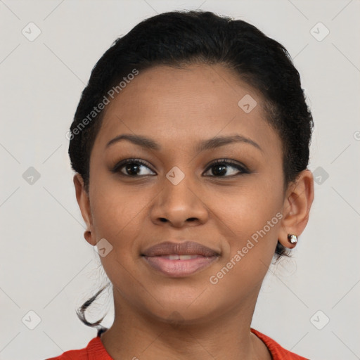 Joyful black young-adult female with short  black hair and brown eyes