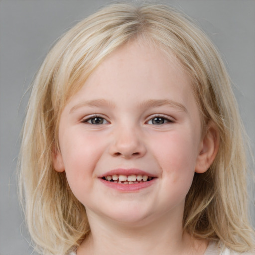 Joyful white child female with medium  brown hair and blue eyes