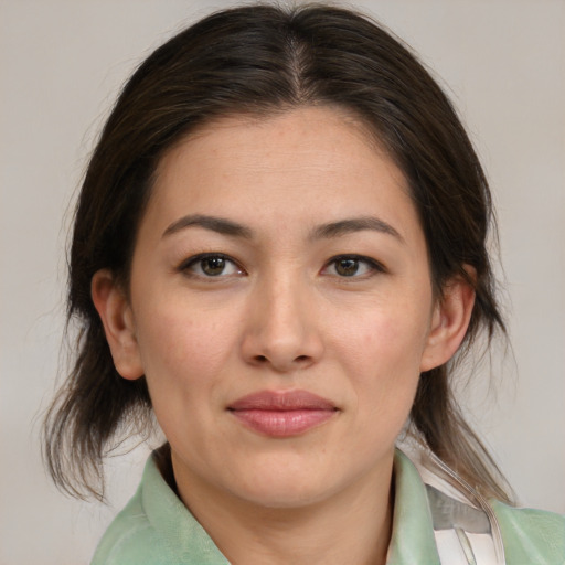 Joyful white young-adult female with medium  brown hair and brown eyes