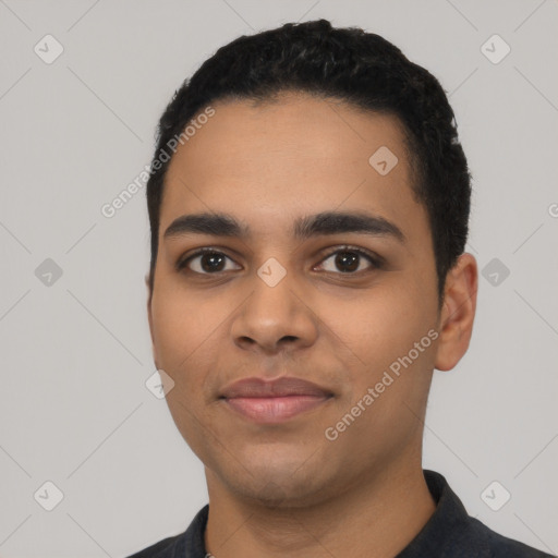 Joyful latino young-adult male with short  black hair and brown eyes