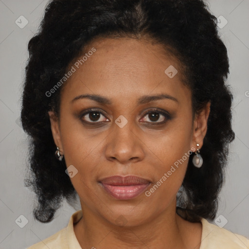 Joyful black adult female with medium  brown hair and brown eyes
