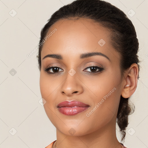 Joyful latino young-adult female with long  brown hair and brown eyes