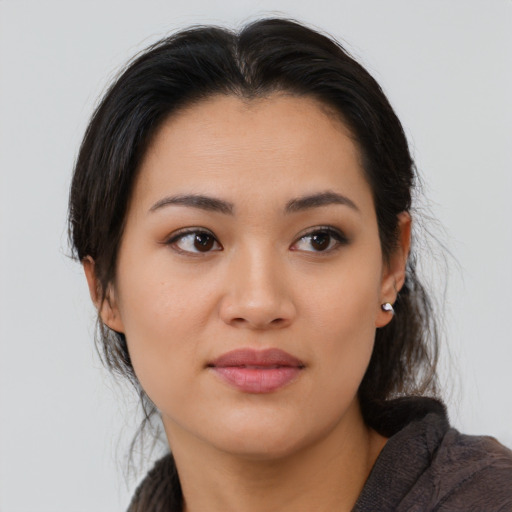 Joyful asian young-adult female with medium  brown hair and brown eyes