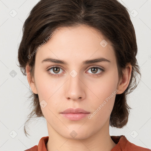 Neutral white young-adult female with medium  brown hair and green eyes