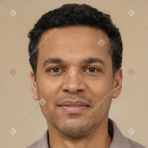 Joyful latino adult male with short  black hair and brown eyes