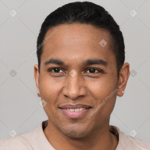 Joyful latino young-adult male with short  black hair and brown eyes