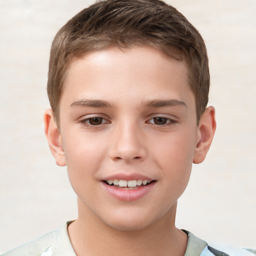 Joyful white child male with short  brown hair and brown eyes