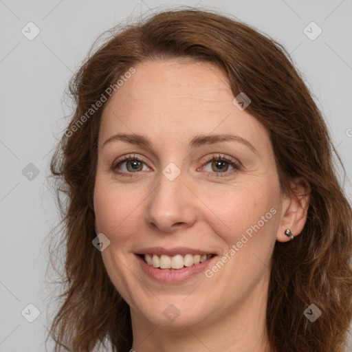 Joyful white young-adult female with long  brown hair and green eyes