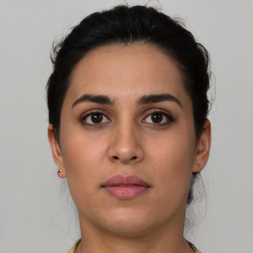 Neutral latino young-adult female with short  brown hair and brown eyes