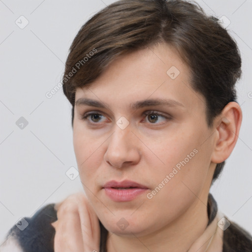 Neutral white young-adult female with short  brown hair and brown eyes