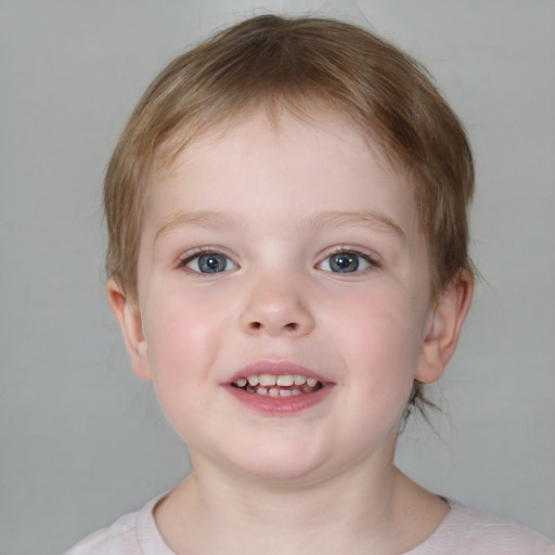 Joyful white child male with medium  brown hair and blue eyes