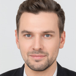 Joyful white young-adult male with short  brown hair and brown eyes