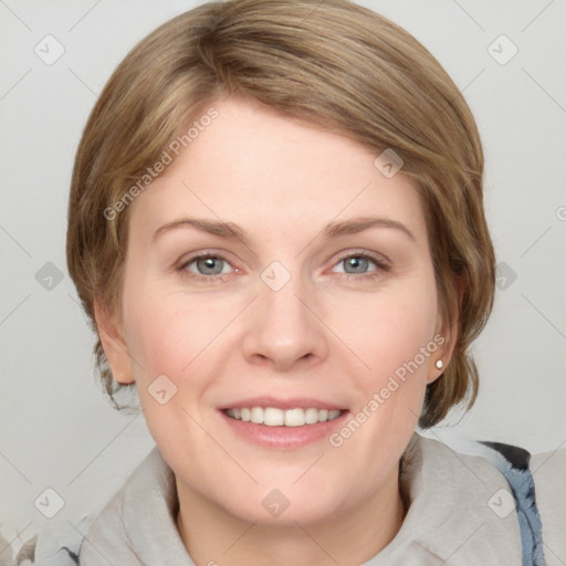 Joyful white young-adult female with medium  brown hair and blue eyes