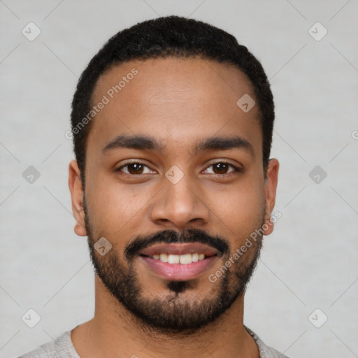 Joyful latino young-adult male with short  black hair and brown eyes