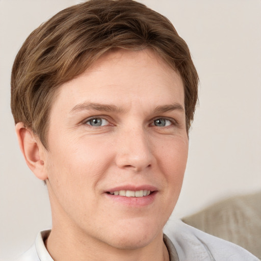 Joyful white adult female with short  brown hair and grey eyes