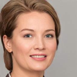 Joyful white young-adult female with long  brown hair and grey eyes