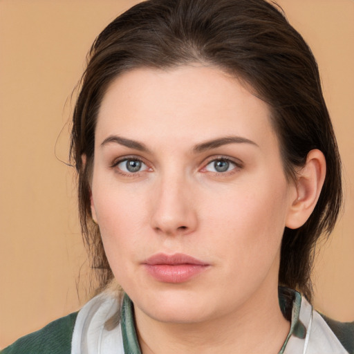 Neutral white young-adult female with medium  brown hair and brown eyes