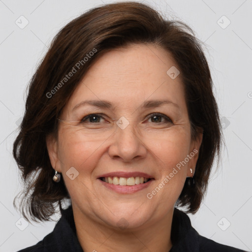 Joyful white adult female with medium  brown hair and brown eyes