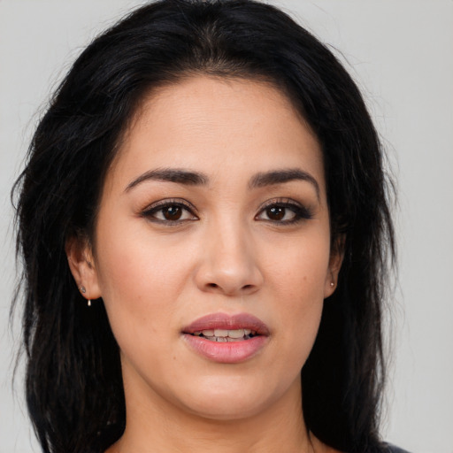 Joyful white young-adult female with long  black hair and brown eyes