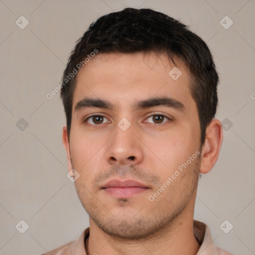 Neutral white young-adult male with short  brown hair and brown eyes