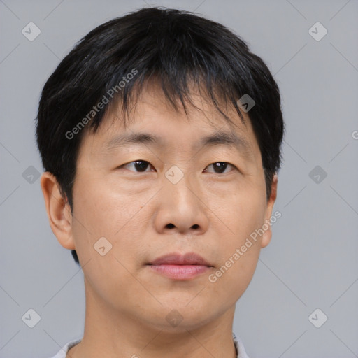 Neutral asian young-adult male with short  brown hair and brown eyes