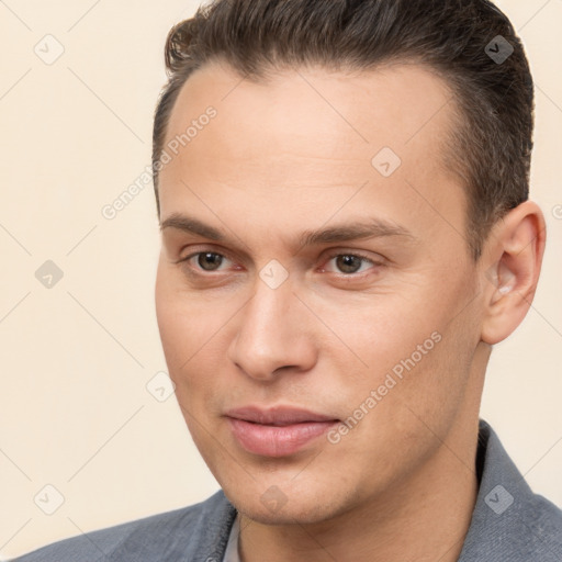 Joyful white young-adult male with short  brown hair and brown eyes