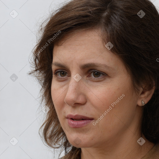 Neutral white adult female with long  brown hair and brown eyes