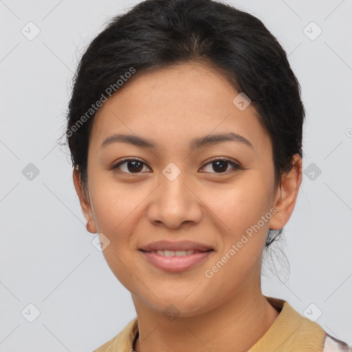 Joyful latino young-adult female with short  brown hair and brown eyes