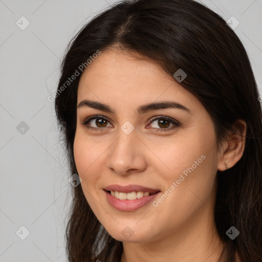 Joyful white young-adult female with long  brown hair and brown eyes