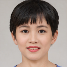 Joyful asian young-adult female with short  black hair and brown eyes