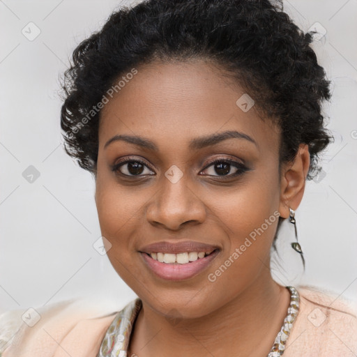 Joyful black young-adult female with long  brown hair and brown eyes