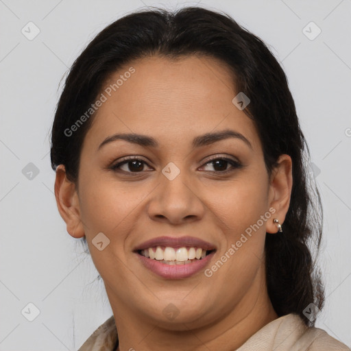 Joyful latino young-adult female with medium  brown hair and brown eyes