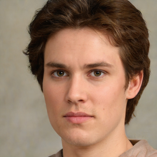 Neutral white young-adult male with medium  brown hair and green eyes