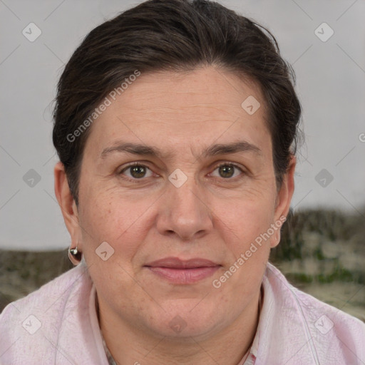 Joyful white adult female with short  brown hair and brown eyes