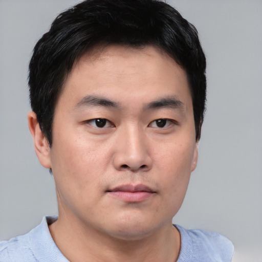 Neutral asian young-adult male with short  brown hair and brown eyes