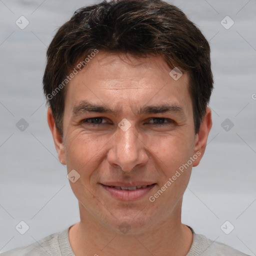 Joyful white adult male with short  brown hair and brown eyes