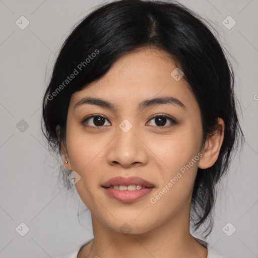 Joyful asian young-adult female with medium  black hair and brown eyes