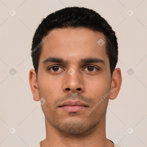 Neutral latino young-adult male with short  black hair and brown eyes