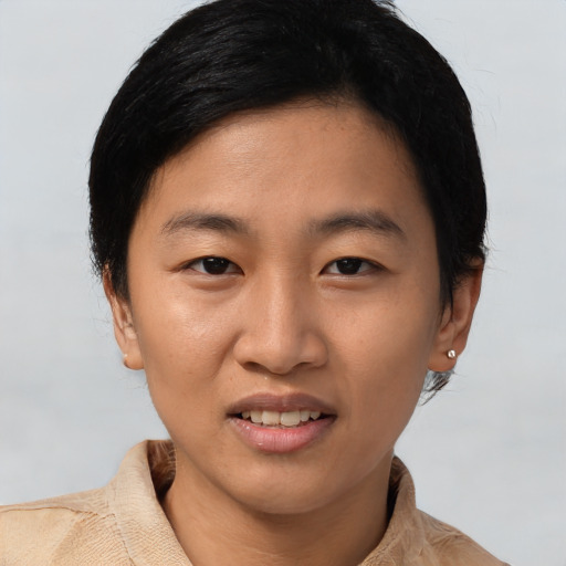 Joyful asian young-adult female with short  black hair and brown eyes