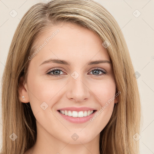 Joyful white young-adult female with long  brown hair and green eyes