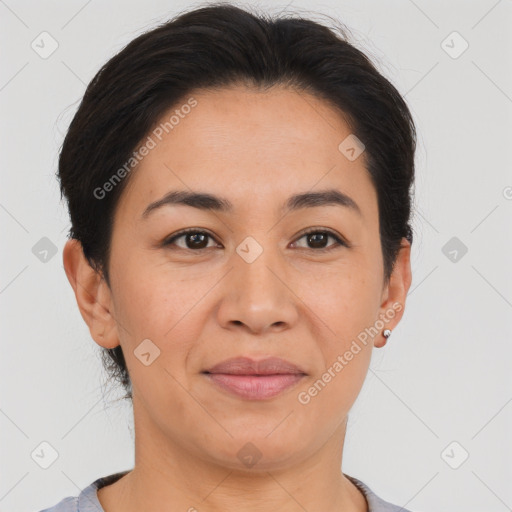 Joyful asian adult female with short  brown hair and brown eyes