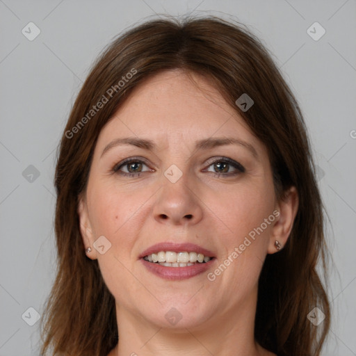 Joyful white adult female with medium  brown hair and brown eyes