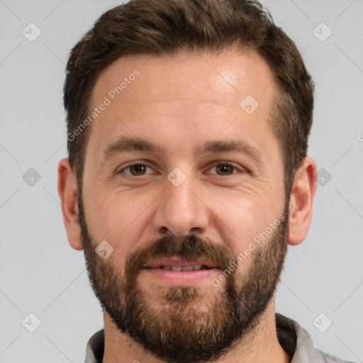 Joyful white adult male with short  brown hair and brown eyes